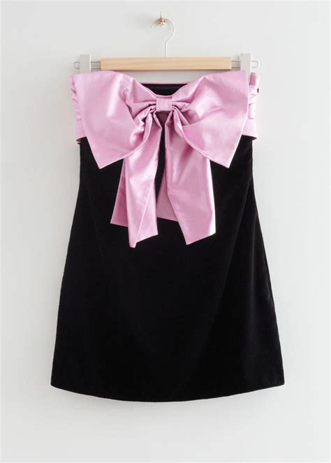 Bustier dress in velvet with oversized bow 